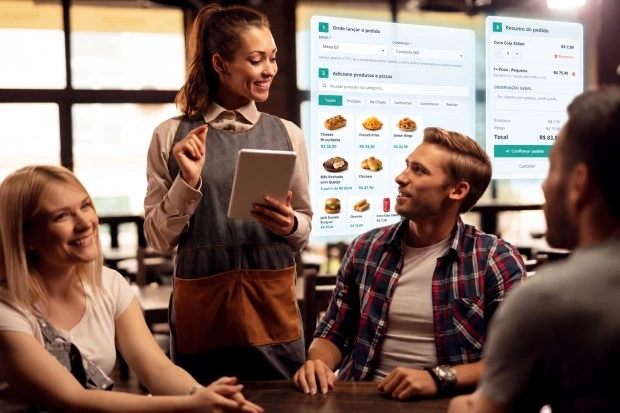 Garçom usando tablet para registrar pedido na mesa do restaurante